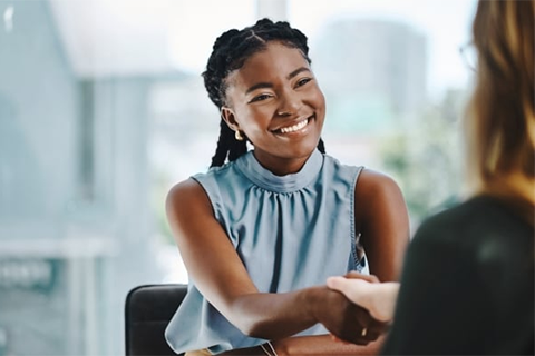 female student shakes employer's hand